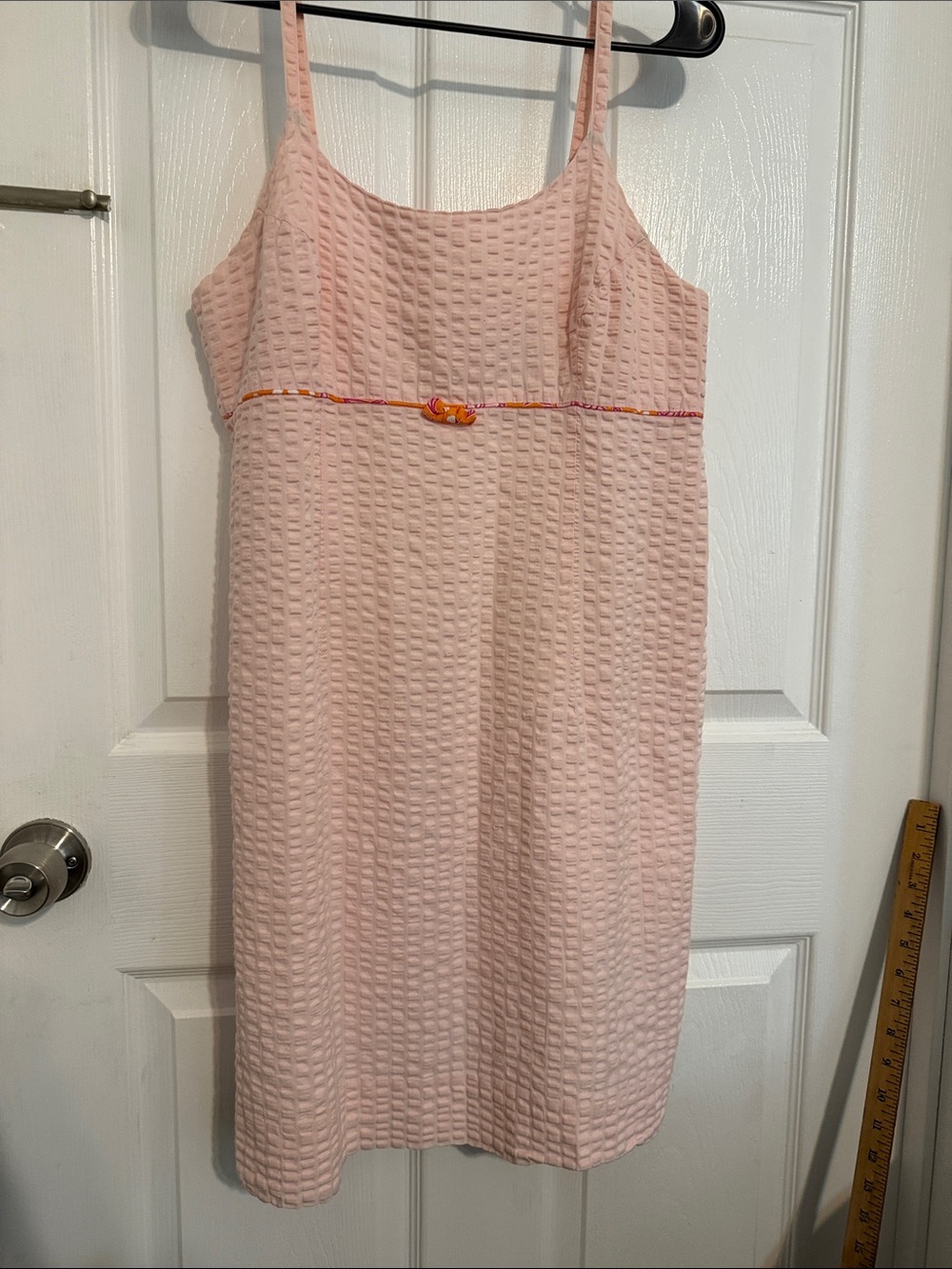 Very Vintage Pale Pink Seersucker dress with orange pipping and bow
Size 10